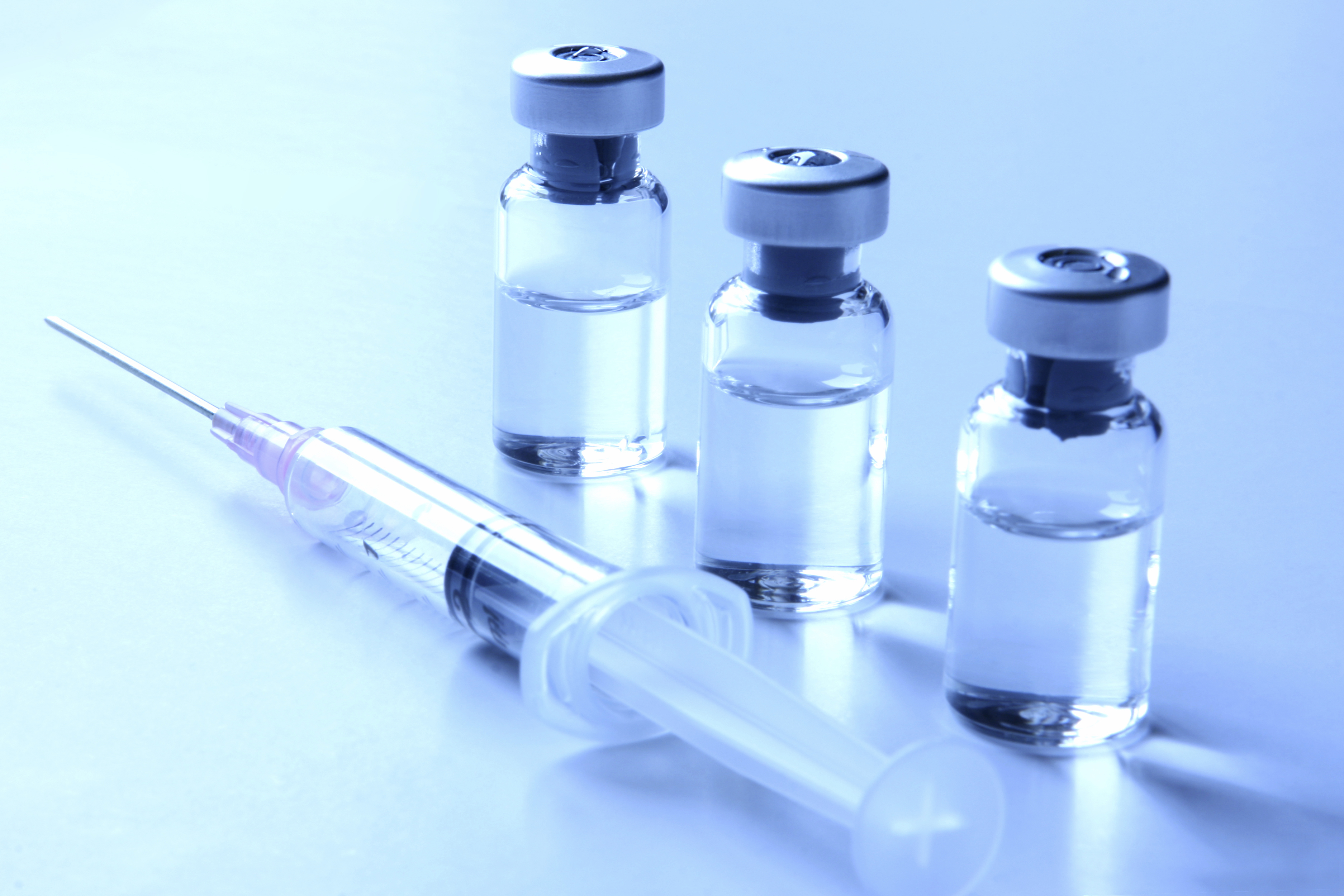 picture of vaccine and needle